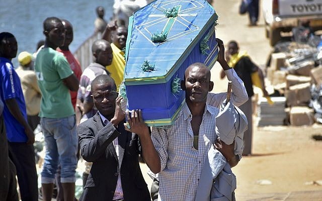 Men carry a coffin for one of the victims of the MV Nyerere passenger ferry on Ukara Island, Tanzania September 22, 2018. (AP Photo) Men carry a coffin for one of the victims of the MV Nyerere passenger ferry on Ukara Island, Tanzania September 22, 2018. (AP Photo)
