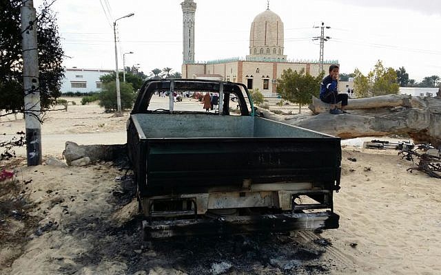 Illustrative: In this November 25, 2017 file photo, a burned truck remains outside the Al-Rawda Mosque a day after attackers killed hundreds of worshipers, in Bir al-Abd northern Sinai, Egypt. (AP Photo/Tarek Samy)