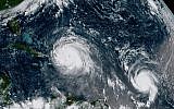 This September 7, 2017 satellite image made available by NOAA shows the eye of Hurricane Irma, left, just north of the island of Hispaniola, with Hurricane Jose, right, in the Atlantic Ocean. (NOAA via AP)