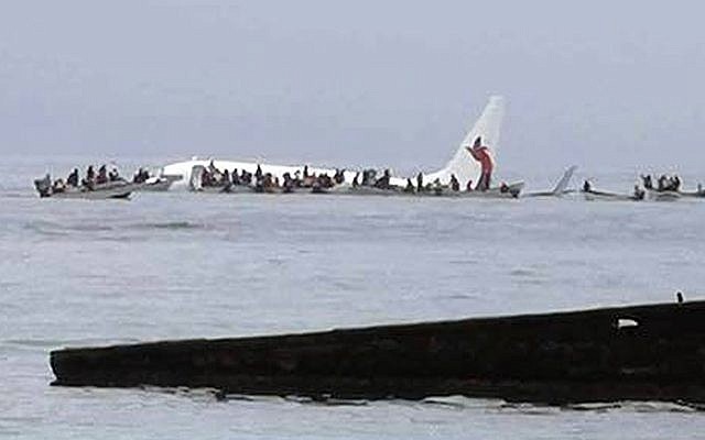 This photo provided by Blue Flag Construction shows an Air Niugini plane floating in Pacific lagoon after its crash-landing in Pacific lagoon near Chuuk Airport in Weno, Federated States of Micronesia, September 28, 2018. (Blue Flag Construction via AP) This photo provided by Blue Flag Construction shows an Air Niugini plane floating in Pacific lagoon after its crash-landing in Pacific lagoon near Chuuk Airport in Weno, Federated States of Micronesia, September 28, 2018. (Blue Flag Construction via AP)