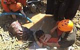 An Indonesian rescue team evacuates a women from damaged areas following earthquakes and a tsunami in Palu, Central Sulawesi, Indonesia, Sunday, September 30, 2018. (AP Photo/Chandra)