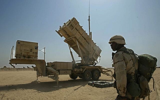 Capt. Issac Gipson of Biloxi, Mississippi, stands in front of a Patriot missile battery of the 5th Bat. 52nd Regiment of Air Defense Artillery at Camp New Jersey in the Kuwaiti desert, March 17, 2003. (AP/Jean-Marc Bouju) Capt. Issac Gipson of Biloxi, Mississippi, stands in front of a Patriot missile battery of the 5th Bat. 52nd Regiment of Air Defense Artillery at Camp New Jersey in the Kuwaiti desert, March 17, 2003. (AP/Jean-Marc Bouju)