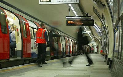 Illustrative: Rush hour passenger walks along an empty platform at Kennington Tube Station in London, Friday, July 8, 2005 (AP Photo/Sergio Dionisio) Illustrative: Rush hour passenger walks along an empty platform at Kennington Tube Station in London, Friday, July 8, 2005 (AP Photo/Sergio Dionisio)