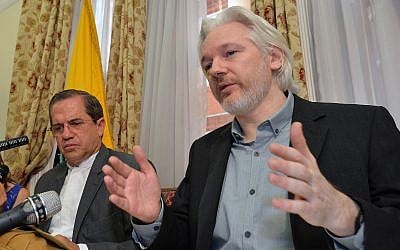 Ecuador's Foreign Minister Ricardo Patino, left, and WikiLeaks founder Julian Assange speak during a news conference inside the Ecuadorian Embassy in London, August 18, 2014. (John Stillwell/Pool Photo via AP)