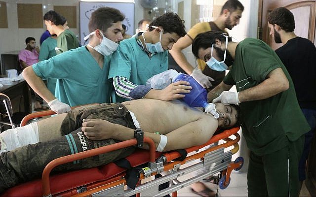 Illustrative: This Tuesday, Sept. 6, 2016 photo, provided by the Syrian anti-government activist group Aleppo Media Center (AMC), shows medical staff treating a man suffering from breathing difficulties inside a hospital in Aleppo, Syria (Aleppo Media Center via AP) Illustrative: This Tuesday, Sept. 6, 2016 photo, provided by the Syrian anti-government activist group Aleppo Media Center (AMC), shows medical staff treating a man suffering from breathing difficulties inside a hospital in Aleppo, Syria (Aleppo Media Center via AP)