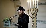 Illustrative: Slomo Koves, chief rabbi of the Chabad-affiliated Unified Israelite Congregation of Hungary (EMIH), speaks during a commemoration marking the Memorial Day of the Hungarian Holocaust victims in the Holocaust Memorial Center in Budapest, Hungary, on April 19, 2017. (Szilard Koszticsak/MTI via AP)