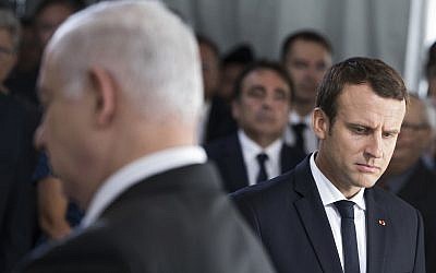 Israeli Prime Minister Benjamin Netanyahu, left, and French President Emmanuel Macron attend a ceremony commemorating the 75nd anniversary of the Vel d'Hiv roundup, Sunday, July 16, 2017 in Paris. (AP Photo/Kamil Zihnioglu, Pool)