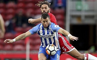 Tomer Hemed, foreground, then on Brighton & Hove Albion, is challenged by Middlesbrough's Ryan Shotton during the FA Cup, fourth round match between Brighton and Middlesbrough, at the Riverside Stadium, Middlesbrough, England, on January 27, 2018. (Owen Humphreys/PA via AP)