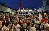 Protesters shout slogans as they gather in front of the Presidential Palace to show President Andrzej Duda their disapproval after he signed the latest legislation on the Supreme Court into law, in Warsaw, Poland July 26, 2018 (AP Photo/Alik Keplicz)