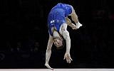 Artem Dolgopyat of Israel performs in the floor exercise during the men's artistic gymnastics finals at the European Championships in Glasgow, Scotland, August 12, 2018. (AP Photo/ Darko Bandic/File)