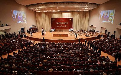 Iraqi lawmakers attend the first parliament session in Baghdad, Iraq, September 3, 2018. (AP Photo/Karim Kadim)