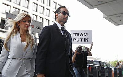 Former Donald Trump presidential campaign foreign policy adviser George Papadopoulos, who triggered the Russia investigation, and who pleaded guilty to one count of making false statements to the FBI, holds hands with his wife Simona Mangiante as they arrive at federal court for sentencing, Friday, Sept. 7, 2018, in Washington. (AP Photo/Jacquelyn Martin)