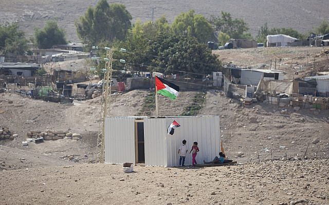 Palestinians girls sit by newly made shed in the West Bank Bedouin community of Khan al-Ahmar, September 11, 2018 (AP Photo/Majdi Mohammed) Palestinians girls sit by newly made shed in the West Bank Bedouin community of Khan al-Ahmar, September 11, 2018 (AP Photo/Majdi Mohammed)