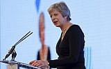 Britain's Prime Minister Theresa May speaks at the United Jewish Israel Appeal charity dinner in London, Sept. 17, 2018. (Peter Nicholls/Pool via AP)