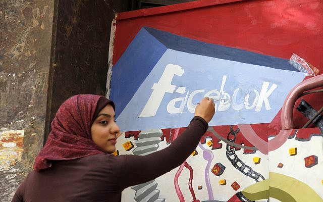 In this March 30, 2011, file photo. an art student from the University of Helwan paints the Facebook logo on a mural commemorating the revolution that overthrew Hosni Mubarak in the Zamalek neighborhood of Cairo, Egypt. (AP/Manoocher Deghati) In this March 30, 2011, file photo. an art student from the University of Helwan paints the Facebook logo on a mural commemorating the revolution that overthrew Hosni Mubarak in the Zamalek neighborhood of Cairo, Egypt. (AP/Manoocher Deghati)