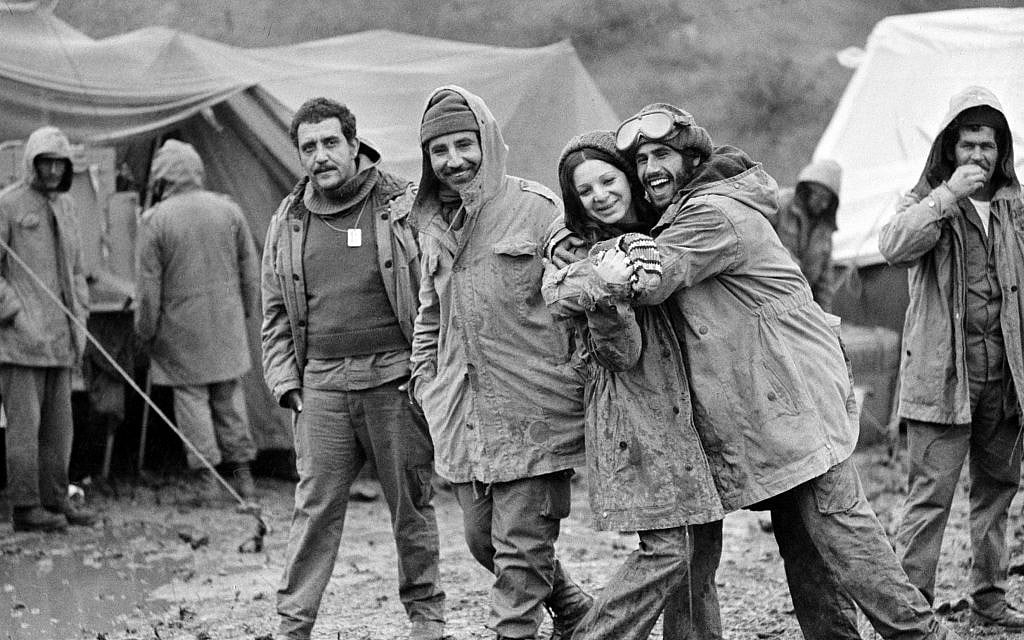 Israeli soldiers at the Syrian ceasefire line in the Golan Heights are seen, October 31, 1973, after sudden cold, rain and fog hit them. Female soldier is radio operator Zehava Mizrachi. Other soldiers are unidentified. (AP Photo) Israeli soldiers at the Syrian ceasefire line in the Golan Heights are seen, October 31, 1973, after sudden cold, rain and fog hit them. Female soldier is radio operator Zehava Mizrachi. Other soldiers are unidentified. (AP Photo)