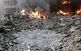 A crater formed after a car bomb targeting the motorcade of Lebanon's most prominent politician, former Lebanese prime minister Rafik Hariri, is seen in Beirut, Lebanon, Feb. 14, 2005. (AP Photo)
