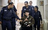Ayman Kurd (c), is escorted by Israeli prison officers at the District court in Jerusalem on February 13, 2018. (Yonatan Sindel/Flash90)