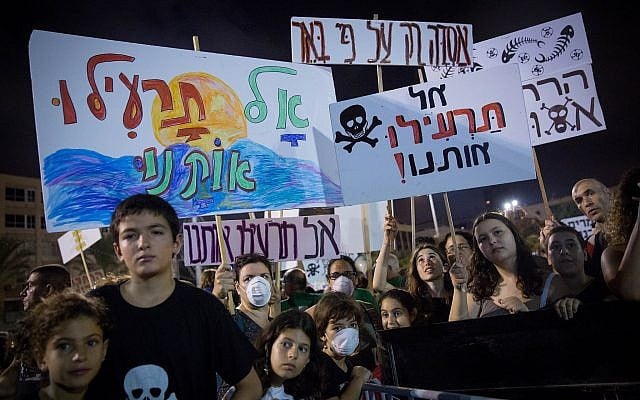 Thousands attend a protest in Tel Aviv, against the plan to build gas rig 10 kilometers from the Israeli coastline on September 1, 2018. The signs read 'don't poison us.' (Miriam Alster/FLASH90) Thousands attend a protest in Tel Aviv, against the plan to build gas rig 10 kilometers from the Israeli coastline on September 1, 2018. The signs read 'don't poison us.' (Miriam Alster/FLASH90)