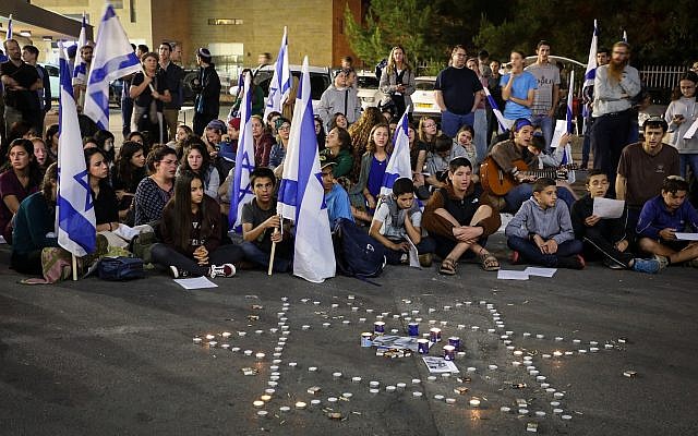Mourners light candles in memory of Ari Fuld, at the site where he was murdered earlier in the day, at the Gush Etzion Junction, September 16, 2018. (Gershon Elinson/Flash90) Mourners light candles in memory of Ari Fuld, at the site where he was murdered earlier in the day, at the Gush Etzion Junction, September 16, 2018. (Gershon Elinson/Flash90)