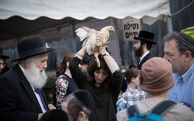 Ultra Orthodox Jews perform the kaparot ritual on September 16, 2018, in the ultra orthodox neighborhood of Me'a Shearim, in Jerusalem. (Noam Revkin Fenton/Flash90) Ultra Orthodox Jews perform the kaparot ritual on September 16, 2018, in the ultra orthodox neighborhood of Me'a Shearim, in Jerusalem. (Noam Revkin Fenton/Flash90)
