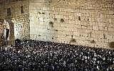 Thousands pray for forgiveness (Selichot) at the Western Wall in the Old City of Jerusalem on September 16, 2018. (Noam Revkin Fenton/Flash90)