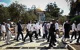 Israeli security forces escort a group of religious Jews, as they visit the Temple Mount on Yom Kippur, September 19, 2018. (Sliman Khader/Flash90)