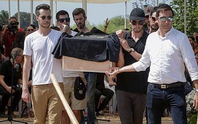 Family and friends carry the coffin of 17-year-old Ari Nesher during the funeral in Moshav Udim cemetery, Sunday, September 30, 2018. (Roy Alima/Flash90)