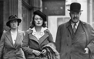 A woman fascist, center, being arrested at the Fascist headquarters in London on May 23, 1940. (AP Photo)
