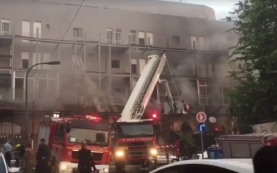 Rescue workers are seen at the scene of a fire at a building in Jaffa on September 2, 2019. (Screen capture: Ynet)