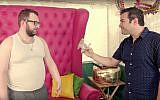 Eli Batalion, left, as Leizer, and Jamie Elman, as Chaimie, discuss their favorite sukkah activities in the web series 'YidLife Crisis.' (Courtesy)