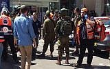 Illustrative: Security forces arrive at the scene after an Israeli man was stabbed in a terrorist attack at a shopping mall next to the Gush Etzion Junction on September 16, 2018. (United Hatzalah)