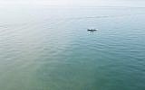 A boat searches the Sea of Galilee for missing swimmer Moshe Shamir, 66, of Tel Aviv on September 15, 2018. (Screen capture: Maariv Online)