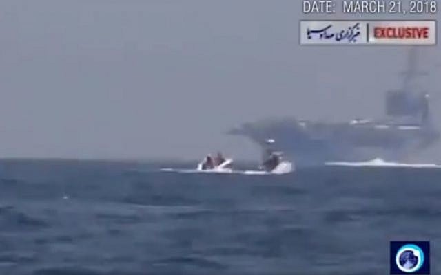 A still from a video published by Iranian state media showing a boat approaching a US carrier in March, 2018. (screen capture: Twitter) A still from a video published by Iranian state media showing a boat approaching a US carrier in March, 2018. (screen capture: Twitter)