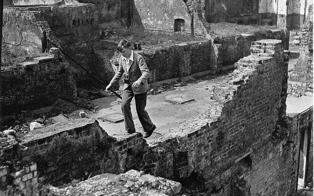Photo of a boy running over ruins, by Edith Tudor-Hart. (Suschitzky family)