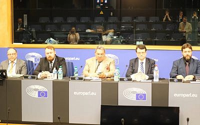 Mark Meechan (second from left), who taught a dog to give a Nazi salute, speaks at a UKIP conference in the European Parliament. (Screen capture: YouTube)