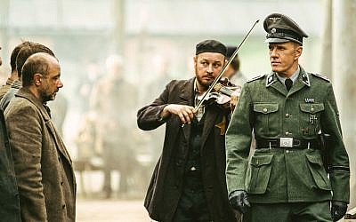 Christopher Lambert, right, portraying a German Nazi officer in “Sobibor.” (Courtesy of Rosiya Segondiya via JTA)