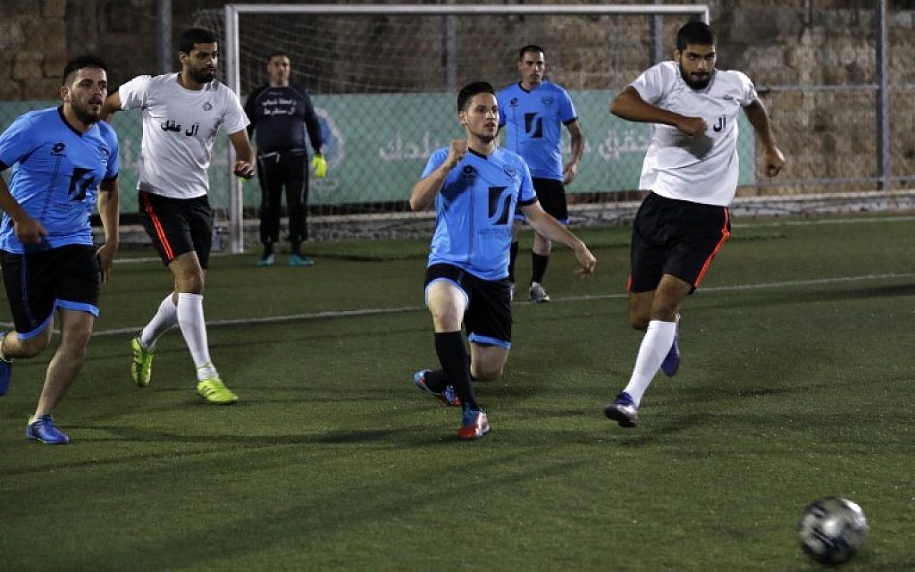 Palestinian soccer players compete against each other for the ball during a second-round match in a month-long tournament pitting together east Jerusalem's largest Palestinian families, in the Burj Luqluq part of Jerusalem's Old City on September 17, 2018. (AFP PHOTO / AHMAD GHARABLI) Palestinian soccer players compete against each other for the ball during a second-round match in a month-long tournament pitting together east Jerusalem's largest Palestinian families, in the Burj Luqluq part of Jerusalem's Old City on September 17, 2018. (AFP PHOTO / AHMAD GHARABLI)