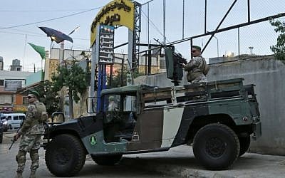 Lebanese security forces guard the entrance of Al-Ahed stadium in Beirut's southern suburbs during a tour organized by the Lebanese foreign minister for ambassadors on October 1, 2018, of alleged missile sites around the Lebanese capital in a bid to disprove Israeli accusations that the Hezbollah movement has secret missile facilities there. (AFP PHOTO / ANWAR AMRO)