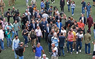Lebanon's Foreign Minister Gibran Bassil gathers 73 foreign envoys and journalists  at Al-Ahed stadium in Beirut's southern suburbs on October 1, 2018 during a tour he organized of alleged missile sites around the Lebanese capital's international airport in a bid to disprove Israeli accusations that the Hezbollah movement has secret missile facilities there. (AFP PHOTO / ANWAR AMRO)