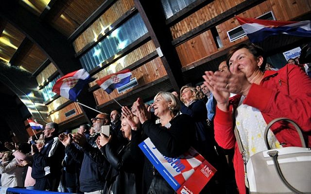 In this photograph taken on September 28, 2018, Bosnian Croat supporters of HDZ, the Croat Democratic Union, the most influential political party among Bosnian Croats, cheer during a pre-election rally in the northwestern Bosnian town of Livno. (AFP Photo/Elvis Barukcic) In this photograph taken on September 28, 2018, Bosnian Croat supporters of HDZ, the Croat Democratic Union, the most influential political party among Bosnian Croats, cheer during a pre-election rally in the northwestern Bosnian town of Livno. (AFP Photo/Elvis Barukcic)