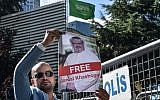 A protestor holds a picture of missing journalist Jamal Khashoggi during a demonstration in front of the Saudi Arabian consulate, on October 5, 2018 in Istanbul. (AFP/ OZAN KOSE)