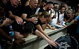 Mother Hava and relatives and friends mourn during the funeral of Kim Levengrond Yehezkel, aged 28, one of the two Israelis killed earlier in a terrorist attack, on October 7, 2018, in Rosh Haayin. (AFP PHOTO / Gil COHEN-MAGEN)