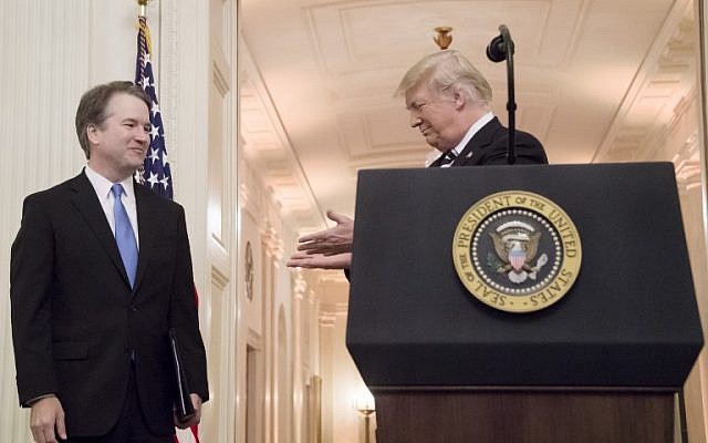 US President Donald Trump, right, gestures to Associate Justice of the US Supreme Court Brett Kavanaugh during a ceremonial swear-in at the White House in Washington, DC, on October 8, 2018. (AFP PHOTO / Jim WATSON) US President Donald Trump, right, gestures to Associate Justice of the US Supreme Court Brett Kavanaugh during a ceremonial swear-in at the White House in Washington, DC, on October 8, 2018. (AFP PHOTO / Jim WATSON)
