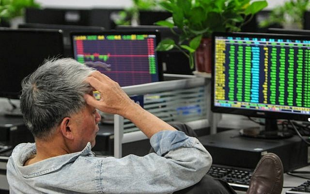 A investor monitors stock prices at a securities company in Jiujiang in China's central Jiangxi province on October 11, 2018 (Photo by STR / AFP) / China OUT A investor monitors stock prices at a securities company in Jiujiang in China's central Jiangxi province on October 11, 2018 (Photo by STR / AFP) / China OUT