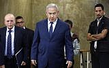 Prime Minister Benjamin Netanyahu arrives for the weekly cabinet meeting at the his office in Jerusalem on October 14, 2018. (Amir Cohen/Pool/AFP)