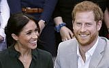 In this file photo taken on October 3, 2018 Britain's Prince Harry, Duke of Sussex (R) and Britain's Meghan, Duchess of Sussex (L) meet with young people on a visit to Joff Youth Centre in Peacehaven in East Sussex, southern England, on October 3, 2018 (Photo by Chris Jackson / POOL / AFP)