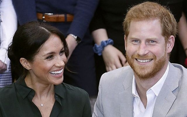 In this file photo taken on October 3, 2018 Britain's Prince Harry, Duke of Sussex (R) and Britain's Meghan, Duchess of Sussex (L) meet with young people on a visit to Joff Youth Centre in Peacehaven in East Sussex, southern England, on October 3, 2018 (Photo by Chris Jackson / POOL / AFP) In this file photo taken on October 3, 2018 Britain's Prince Harry, Duke of Sussex (R) and Britain's Meghan, Duchess of Sussex (L) meet with young people on a visit to Joff Youth Centre in Peacehaven in East Sussex, southern England, on October 3, 2018 (Photo by Chris Jackson / POOL / AFP)