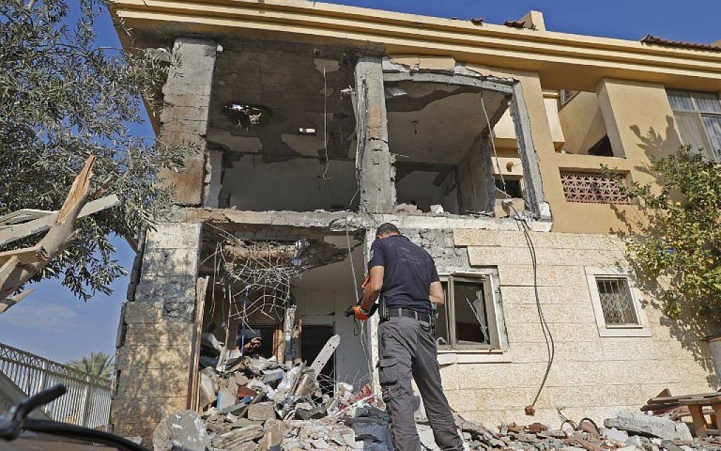 An Israeli sapper checks a house in the southern city of Beersheba after it was hit by a rocket fired from the Hamas-run Gaza Strip on October 17, 2018. (Jack Guez/AFP)