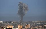 Smoke billows following an Israeli airstrike in the southern Gaza Strip city of Rafah on October 17, 2018. (Said Khatib/AFP)